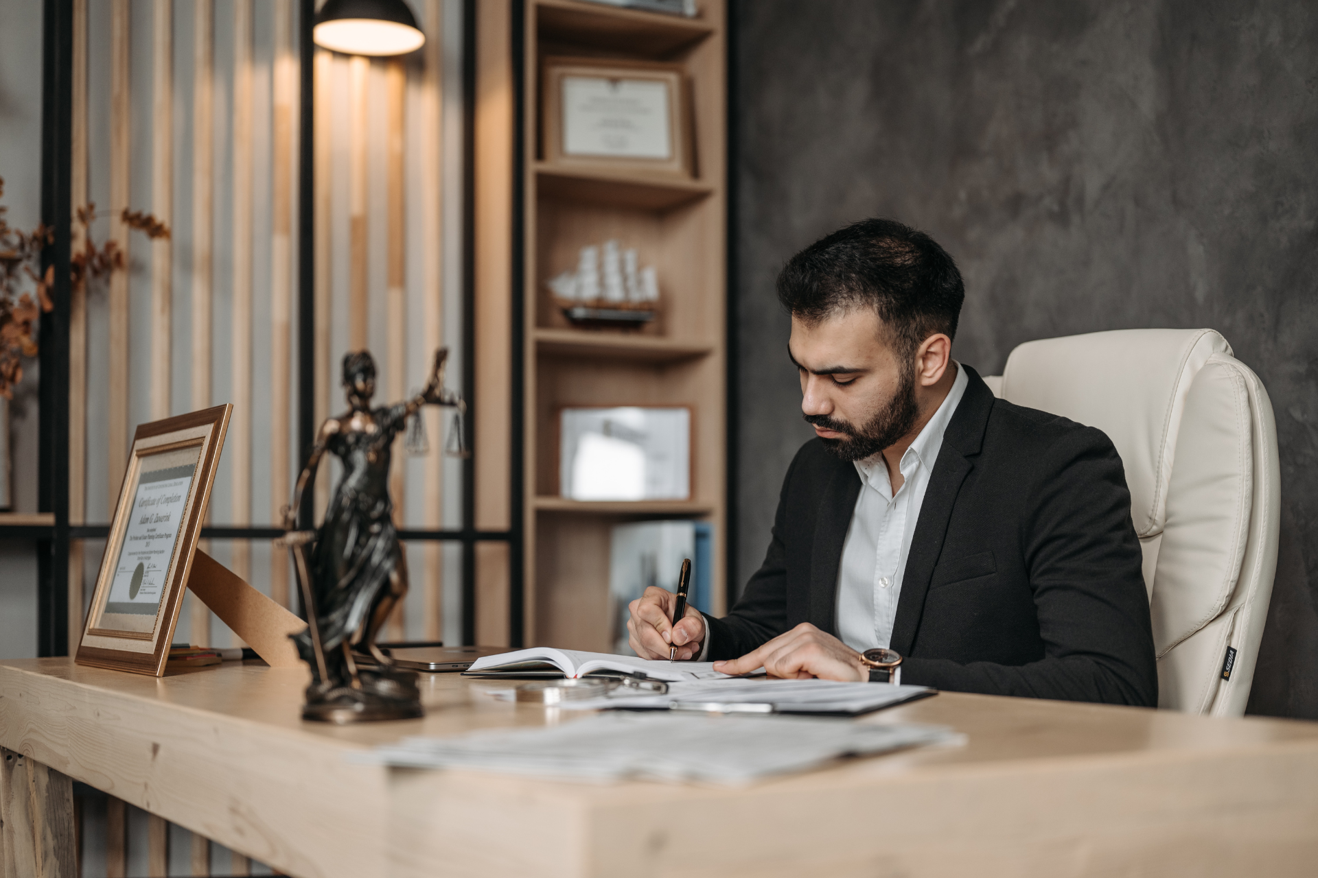 Professional service provider reviewing client documents in a private office